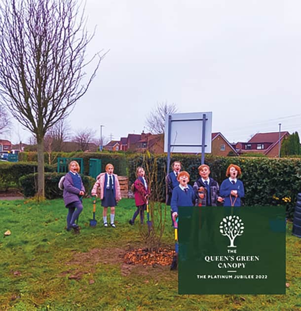 3. Carleton Green children say ‘Arbor Day’ for their Queen’s Green Canopy plaque photograph. (Photo: Carleton Green Community Primary School)