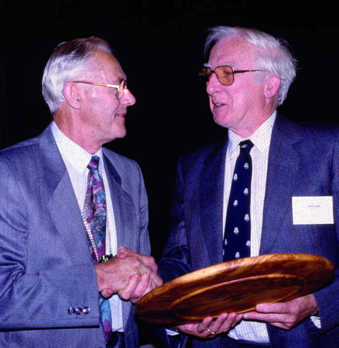 Leo Pemberton (left) presenting the Arboricultural Association Award to Fred Last in September 1993