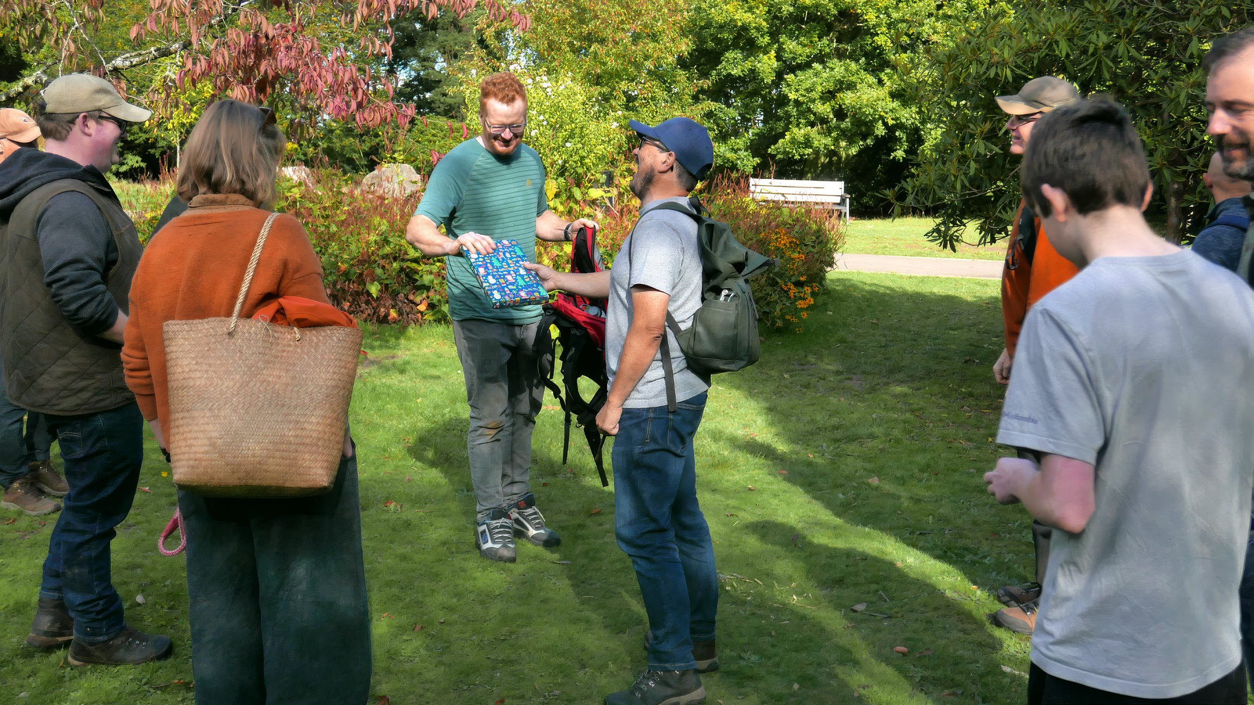 Steve Lucocq presenting our guide, Teifion Davies,  with an early Christmas present – no doubt a fungi book!