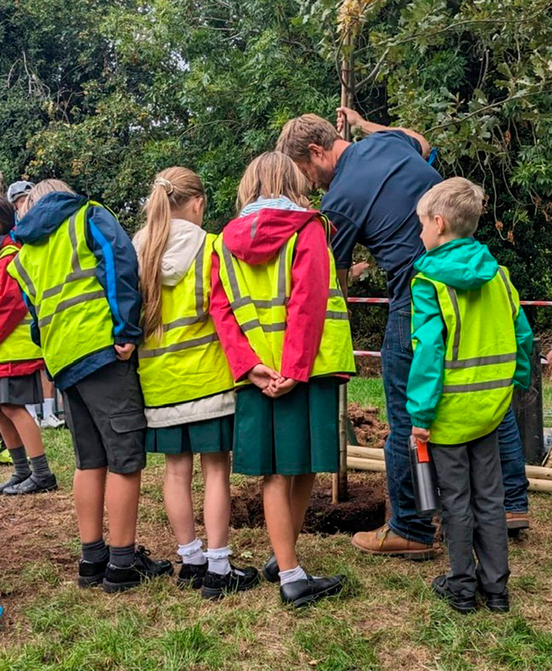 John Parker, Arb Association CEO, leading tree planting with children from Cherry Orchard Primary School, Worcester.