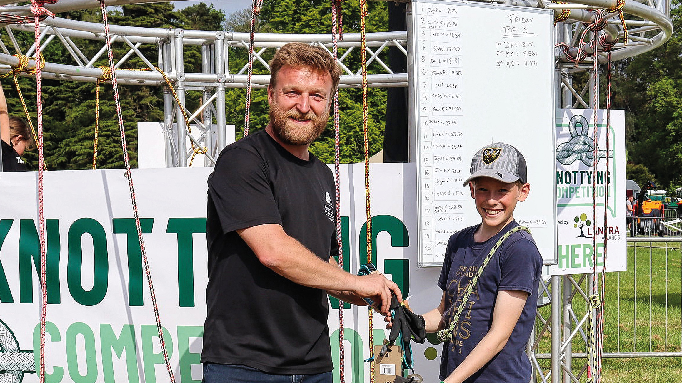 John Parker, Arboricultural Association CEO, presents Charlie Graham with his prize for second place