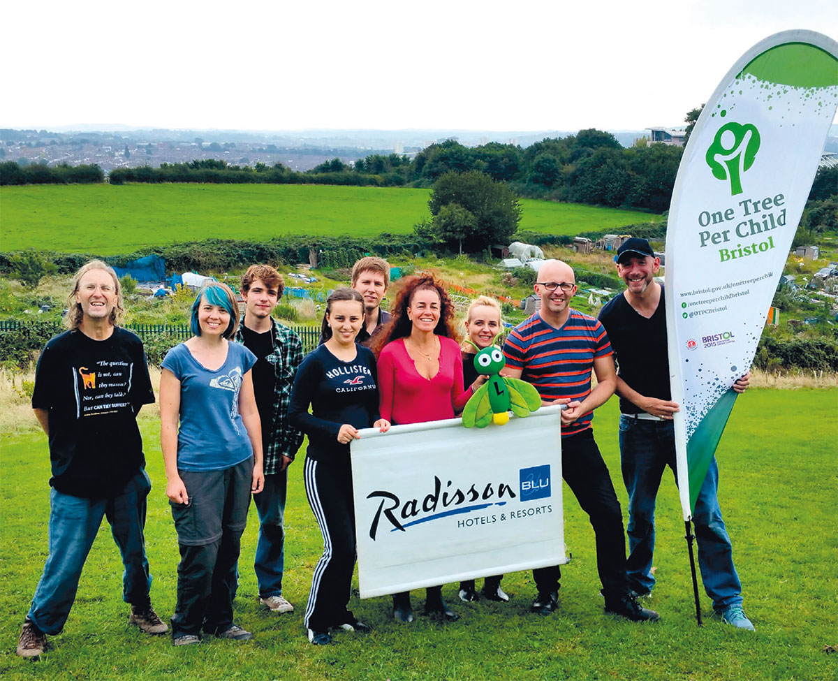 Radisson staff carrying out voluntary tree maintenance work at an urban site in Bristol. (Photo: Bristol City Council)